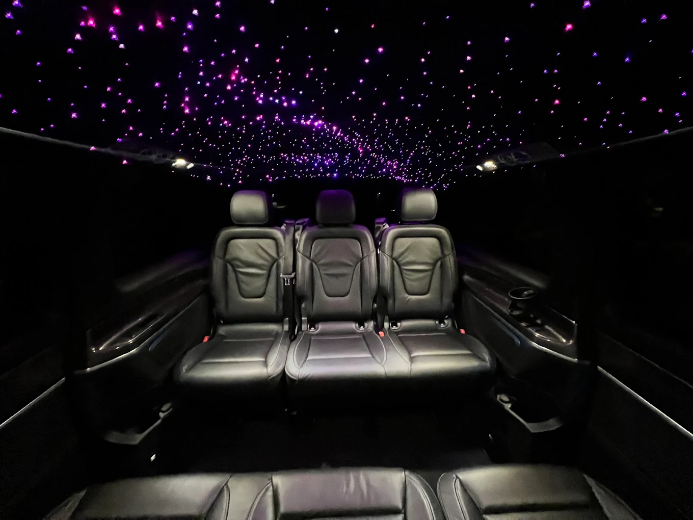 Mercedes V-Class interior with black leather seats and a starlight ceiling